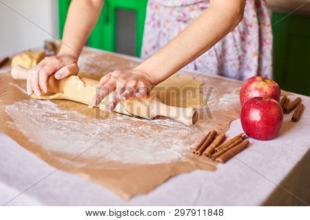 Woman Kneading Dough For The Apple Pie On Kitchen Table. Rustic Style