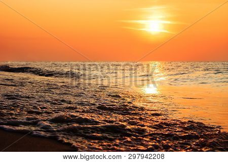 Red Orange Ocean Beach Sunrise/sunset. Colorful Close Up Waves. Sun Reflection