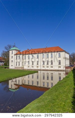 Castle Westerholt With Reflection In The Water In Germany
