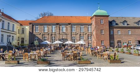 Herten-westerholt, Germany - April 01, 2019: Panorama Of People Enjoying The Sun At The Castle In We