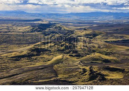 Dramatic Iceland Landscape Of Craters Of Laki Volcanic Fissure With A Green Hill And Black Lava Look
