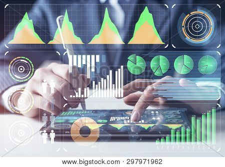Businessman Analysis Trading Diagram At Tablet Computer. Statistical Model Prediction To Provide Ins