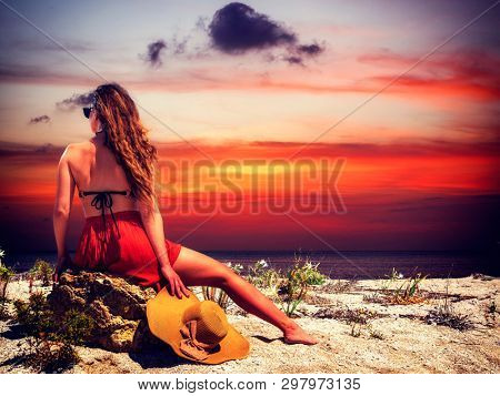 woman sunbathing on the beach summer travel holidays