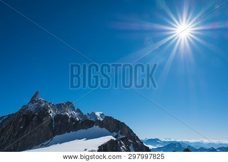 Dente Del Gigante In The Blue Sky With Sun