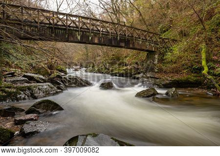 Long Exposure Of The East Lyn River Flowing Under A Bridge At Watersmeet In Exmoor National Park In 