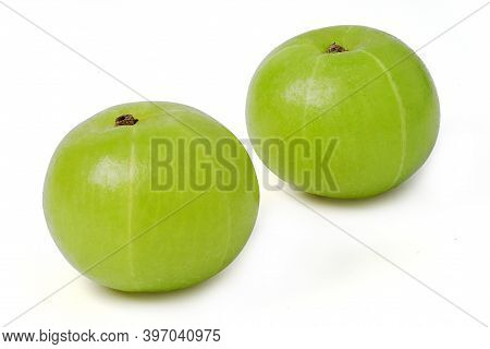 Isolated Amla. Two Indian Gooseberry Fruits Or Amla ( Phyllanthus Emblica ) With Green Leaf And Slic