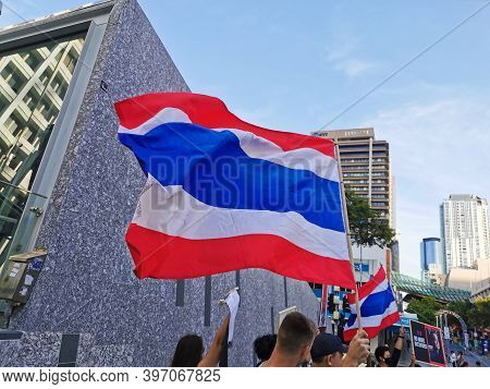 Brisbane, Australia - November 29, 2020: Group Of Protestors Shows Thailand National Flag While Peac