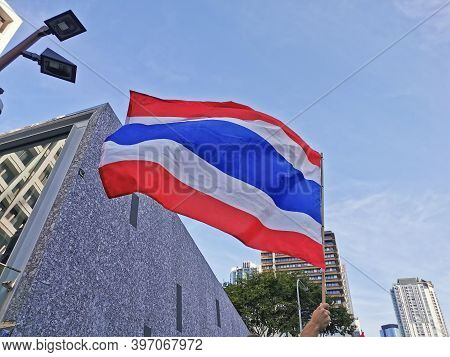 Brisbane, Australia - November 29, 2020: Group Of Protestors Shows Thailand National Flag While Peac