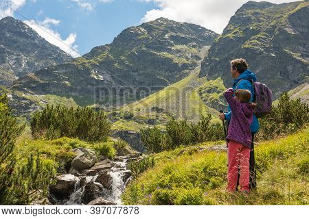 Father And Son Travel Hiking In Mountains, Family Tourism, Tatra Mountains National Park In Zakopane