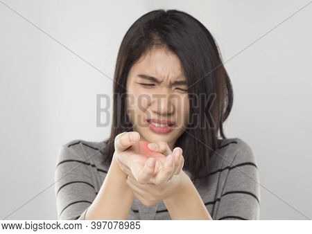 Young Asian Woman Holding Her Hand And Feel Hand Pain From Office Syndrome
