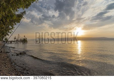 Sunset Over The Sea Of Galilee And Golan Heights. High Quality Photo.