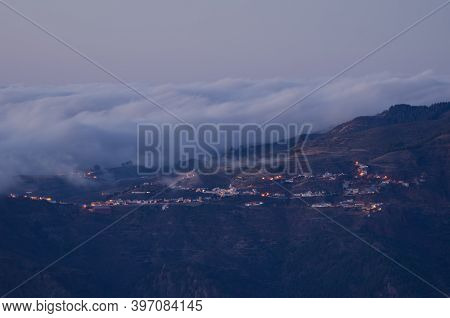Town Of Artenara At Sunset And Sea Of Clouds. The Nublo Rural Park. Gran Canaria. Canary Islands. Sp