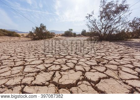 Dry Cracked Soil In The Wadi Araba Desert. Jordan Landscape
