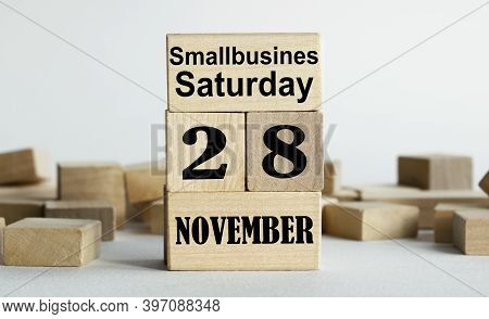 Smallbusiness Saturday Is Written On Wooden Cubes Stacked In The Form Of A Mobile Calendar.