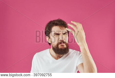 Man In White T-shirt Tinplate Hands Emotions Pink Background