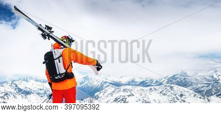 Panoramic Portrait Of A Stern Climber Skier In Sunglasses And A Cap With A Ski Mask On His Face. Hol