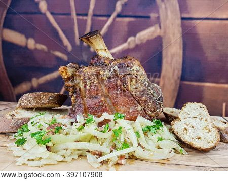 Pork Knuckle With White Cabbage And Bread