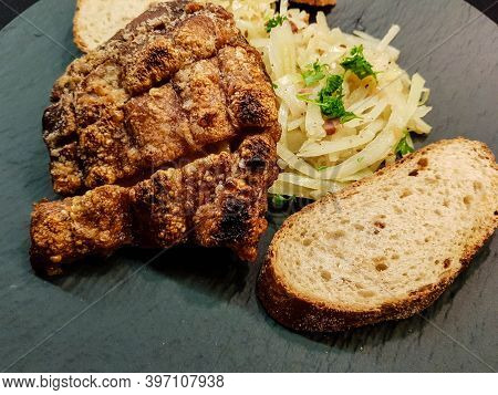 Pork Knuckle With White Cabbage And Bread