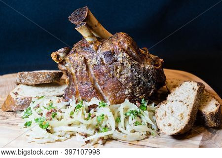 Pork Knuckle With White Cabbage And Bread