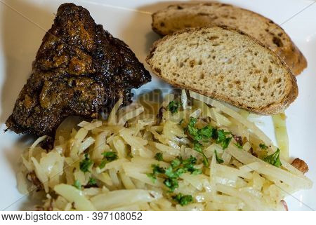 Pork Knuckle With White Cabbage And Bread