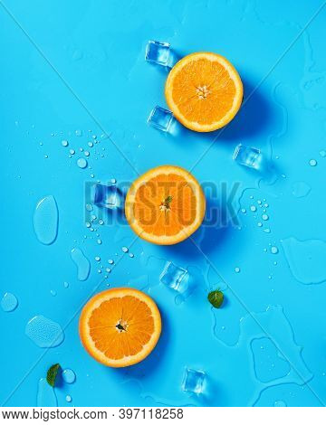 Juicy Citrus Fruits With Ice And Mint Leaves