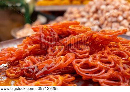 Fresh Jalebi Sweet Snack Outdoors In A Bazaar.