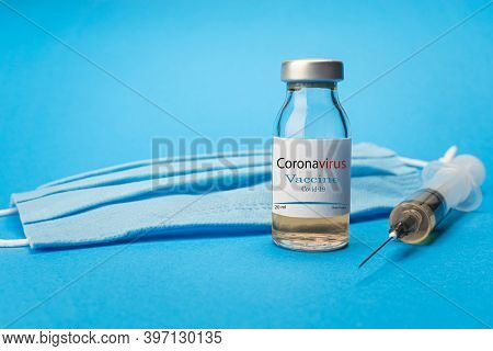 Coronavirus Vaccine Concept And Background. New Vaccine Sputnik-v Isolated On Blue Background. Covid
