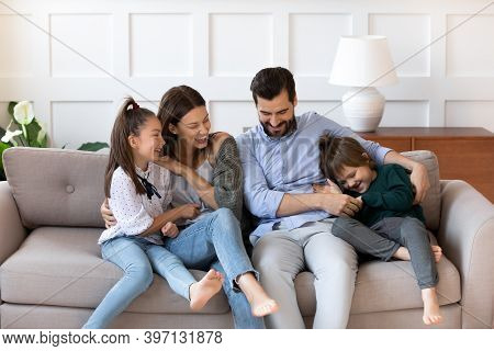 Happy Family With Kids Have Fun In New Home