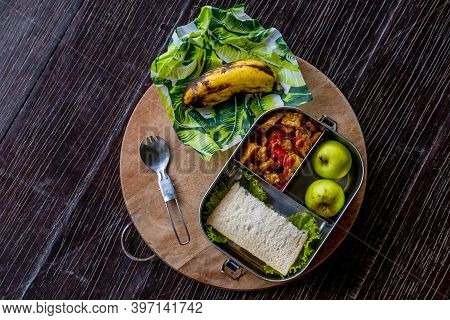 Healthy Vegan Meal Served In Eco-friendly Kitchen Tableware: Stainless Metal Food Container Or Lunch