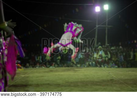 Blurred Image Of Tribal Dancer Jumping In Air, Erforming At Chhou Dance Festival. Indian Tribal Mart