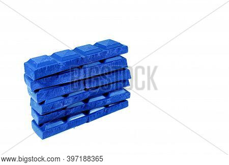Pop Art Style Cobalt Blue Colored Stack Of Chocolate Chunks Isolated On White Background