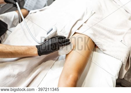Determining The Amount Of Sebum On Female Leg Using Medical Caliper, Close-up