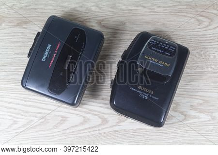 Primelin - France, February 13, 2020 : Aiwa And Thomson Walkman On Wooden Background