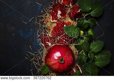 Red Pomegranate In The Starw, Rustic Style, Black Background, Top View