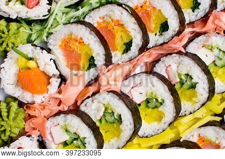 Sushi Background. Tasty Food On Buffet Party. Banquet Snacks Texture. Raw Fish Snacks. Japanese Typi