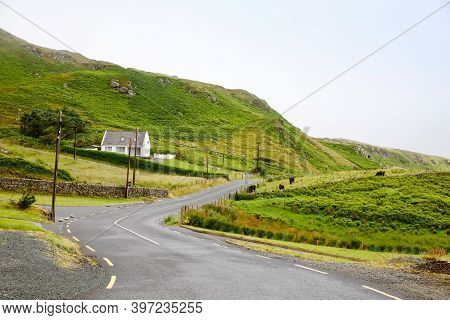 Rugged Landscape At Malin Head, County Donegal, Ireland. Beach With Cliffs, Green Rocky Land With Sh