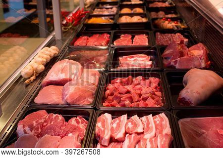 Raw Meat In Assortment In A Butcher Shop. Assortment In A Butcher Shop