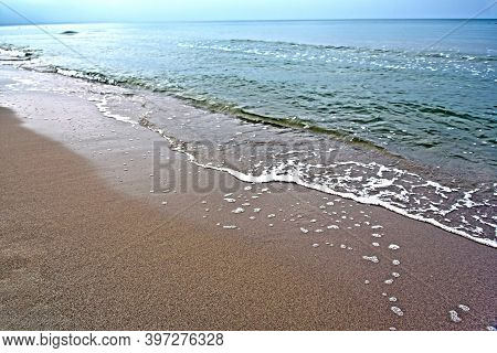 Sandy Deserted Seashore. Cold Deserted Beach. Baltic Sea
