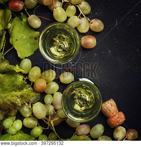 Champagne In Glasses, Grapes With Vine, Black Background, Top View