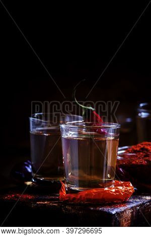 Pepper Vodka, Dark Vintage Wooden Background, Selective Focus