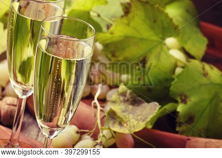 Champagne In Glasses, Grapes With Vine, Vintage Wood Background, Selective Focus
