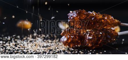 Candy Cane Sugar, Brown Sugar Sticks On A Dark Table, Selective Focus