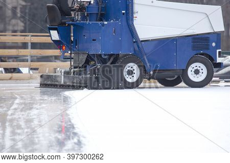 Special Machine For Cleaning Ice On An Ice Rink At Work. Transport Industry