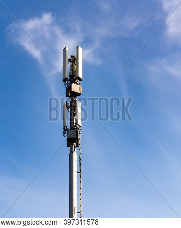 Cellular Communications Mast With Various Telecom Devices.