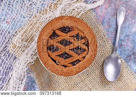 Top View Of Small Homemade Tartlet Called 'linzertorte', A Traditional Austrian Shortcake Pastry Top