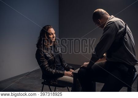 A Police Detective Suspects A White Man Of Committing A Crime. Conducts An Interrogation With The Pr