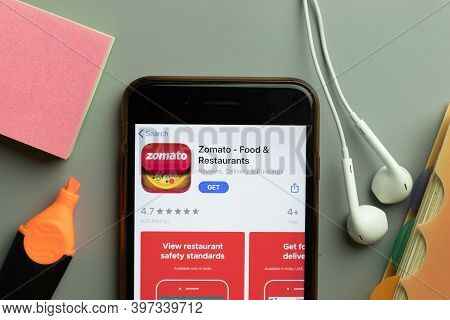 New York, Usa - 1 December 2020: Zomato Mobile App Icon On Phone Screen Top View, Illustrative Edito