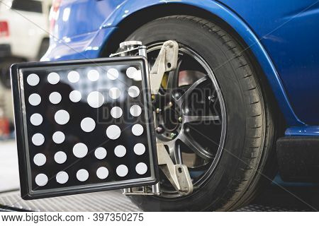 Car In Service With Sensors On The Wheels To Check Alignment Camber Toe