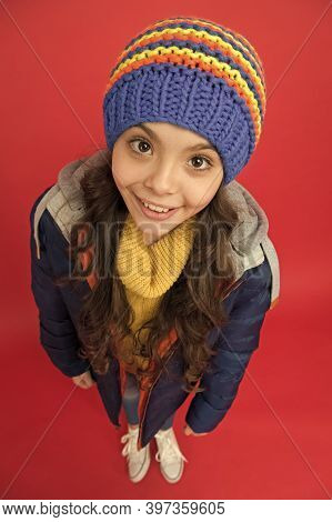 Cute Off Scale. Smiling Adorable Face. Little Girl Wear Winter Clothes Red Background. Childhood Con