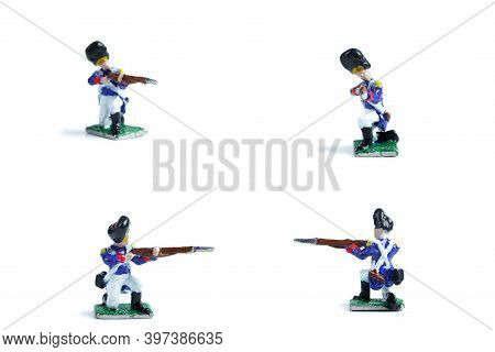 4 In 1 Shot Of Handmade Metal Soldiers With Musket On The White Background
